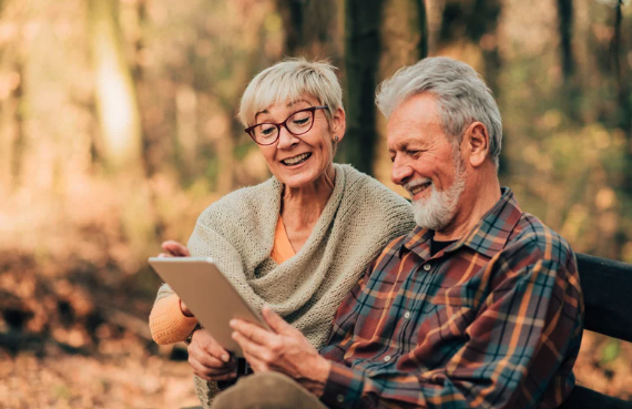 an aged couple reviewing a medic-aid papers