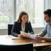 A family law attorney explaining a legal document to a client