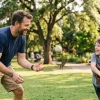 A happy father playing baseball with his son