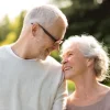 a couple smiling to each other